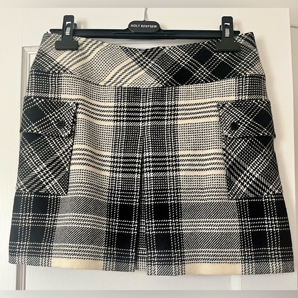Teenflo skirt with 2 front/side patch pockets and kick pleat. Classic plaid. - Picture 1 of 2
